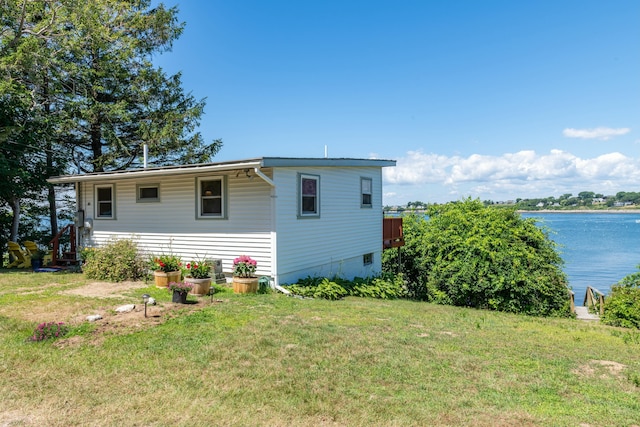 43 W Shore Rd, Harpswell, ME 04003 - exterior space featuring a front lawn and a water view