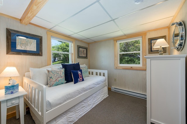 43 W Shore Rd, Harpswell, ME 04003 - carpeted bedroom featuring wooden walls, a baseboard radiator, and multiple windows