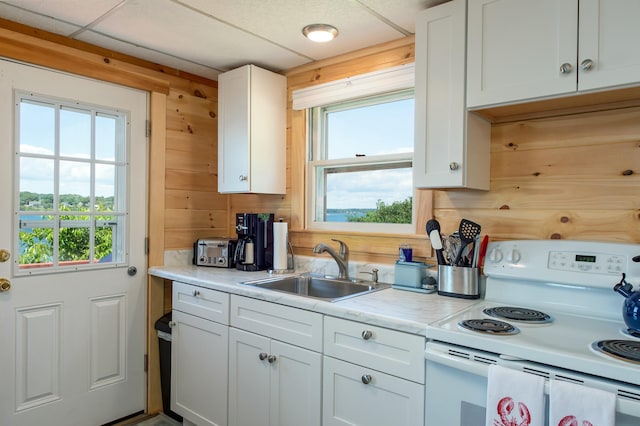 43 W Shore Rd, Harpswell, ME 04003 - kitchen with light countertops, white electric stove, plenty of natural light, and a sink