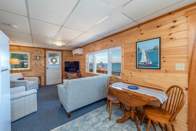 43 W Shore Rd, Harpswell, ME 04003 - living area with wood walls, a drop ceiling, and a wall unit AC