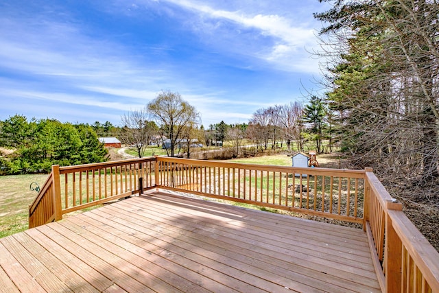 deck with an outbuilding and a storage shed