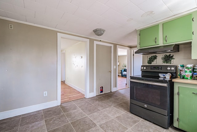 kitchen featuring green cabinets, under cabinet range hood, electric stove, and tile patterned floors