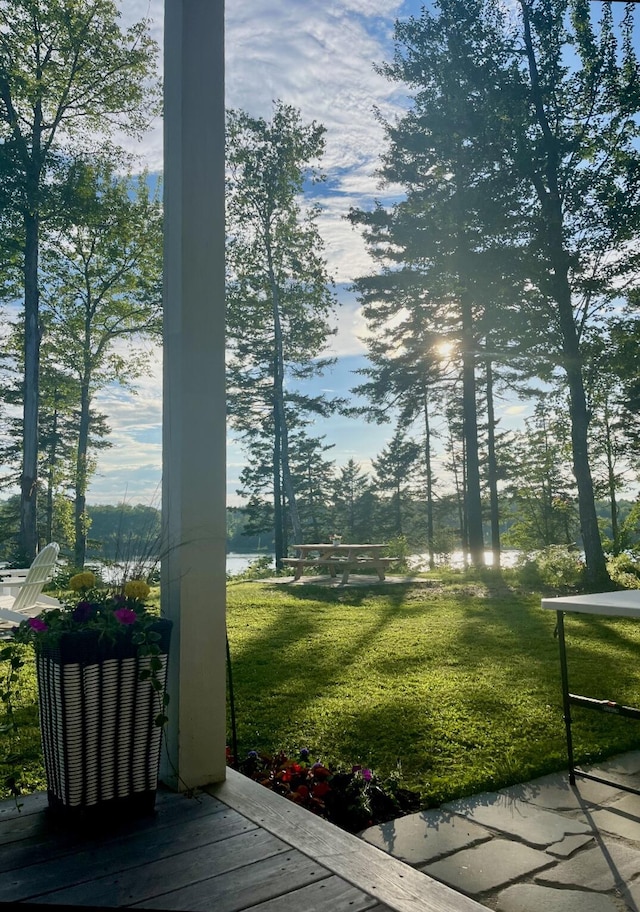 view of property's community with a lawn