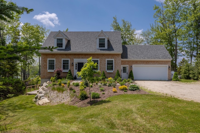 52 Boulder Cove Way, Lamoine, ME 04605 - cape cod house featuring driveway, a garage, a front yard, and roof with shingles