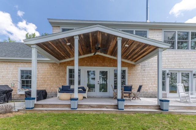 52 Boulder Cove Way, Lamoine, ME 04605 - back of property with french doors, a wooden deck, and a ceiling fan