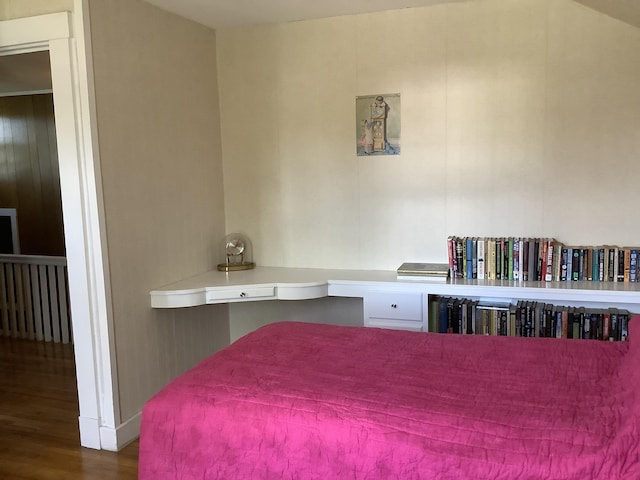 bedroom featuring wood finished floors