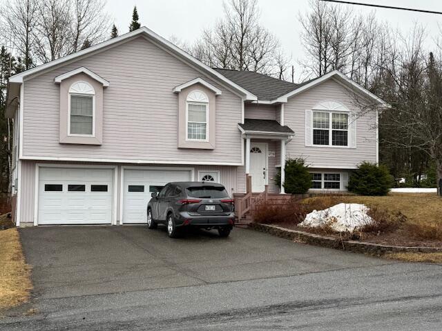 274 19th Ave, Madawaska, ME 04756 - raised ranch with a garage and aphalt driveway