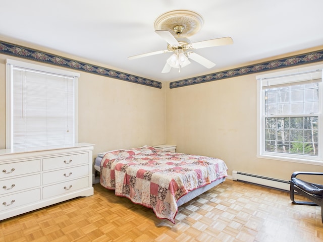 274 19th Ave, Madawaska, ME 04756 - bedroom featuring a baseboard heating unit and a ceiling fan