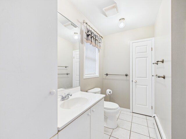 274 19th Ave, Madawaska, ME 04756 - half bathroom featuring tile patterned flooring, visible vents, toilet, vanity, and a baseboard heating unit