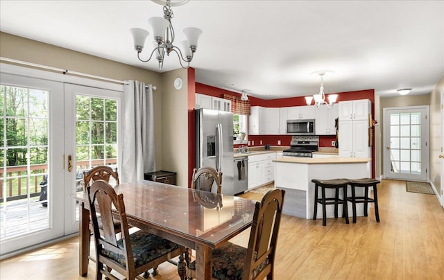 95 The Woods Rd, Union, ME 04862 - dining area with a chandelier and light wood finished floors