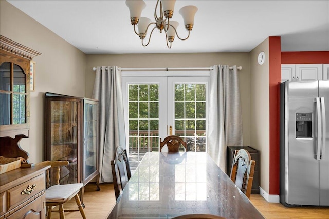 95 The Woods Rd, Union, ME 04862 - dining space featuring light wood-style floors, a chandelier, and french doors