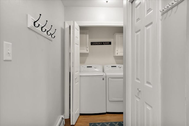 95 The Woods Rd, Union, ME 04862 - laundry room featuring washer and dryer, cabinet space, and wood finished floors