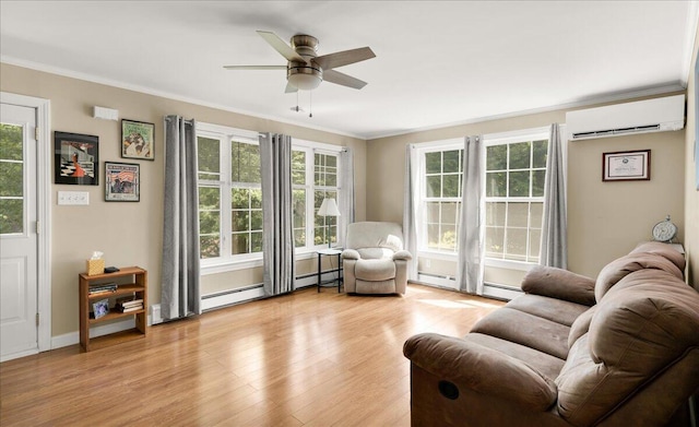 95 The Woods Rd, Union, ME 04862 - living room with a wall mounted air conditioner, ceiling fan, light wood-style floors, crown molding, and a baseboard heating unit