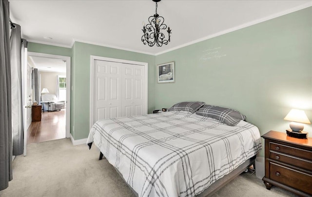 95 The Woods Rd, Union, ME 04862 - bedroom with light colored carpet, a chandelier, a closet, and crown molding
