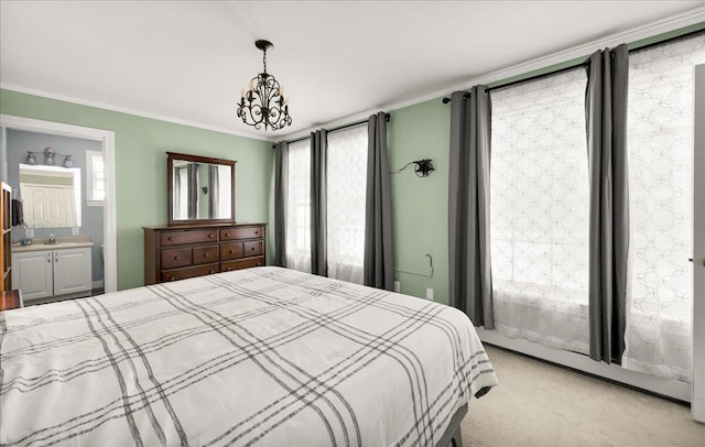 95 The Woods Rd, Union, ME 04862 - bedroom with light colored carpet, ornamental molding, ensuite bathroom, and a chandelier