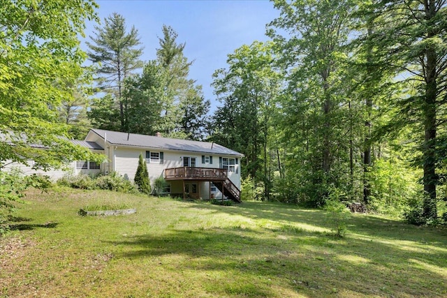 95 The Woods Rd, Union, ME 04862 - view of grassy yard featuring stairway and a deck