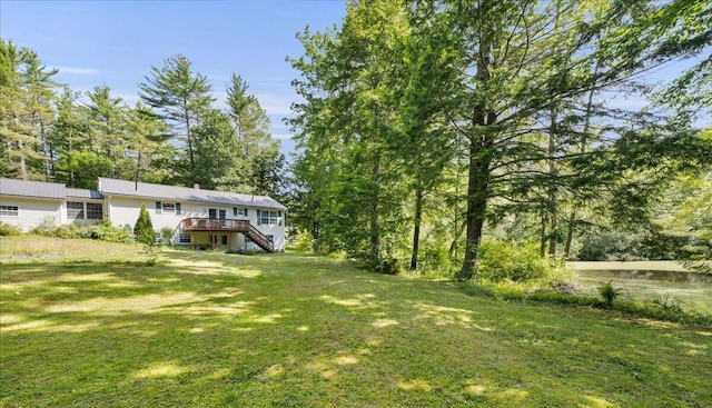 95 The Woods Rd, Union, ME 04862 - view of green lawn with stairs and a deck