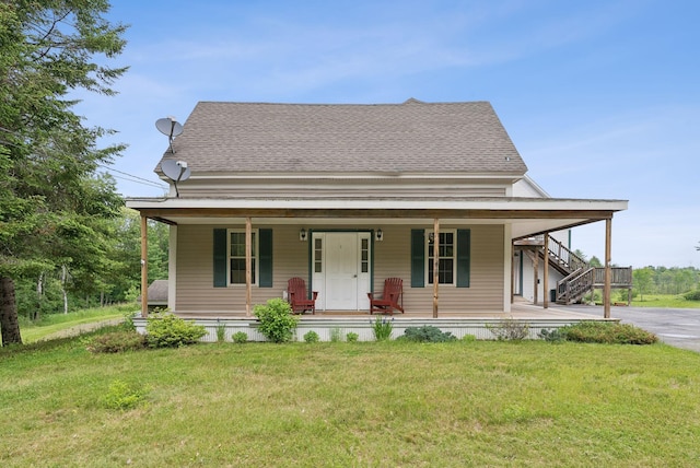 1228 Long Plains Rd, Buxton, ME 04093 - country-style home with a porch, a front yard, and roof with shingles