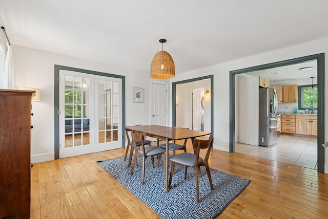 1228 Long Plains Rd, Buxton, ME 04093 - dining space featuring light wood-style flooring and french doors