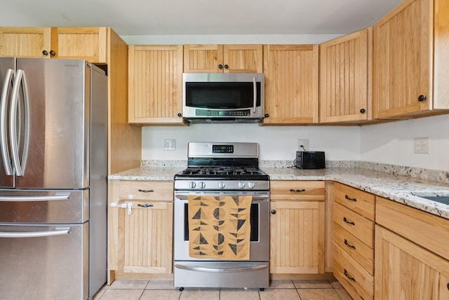 1228 Long Plains Rd, Buxton, ME 04093 - kitchen with stainless steel appliances, light brown cabinetry, and light tile patterned floors