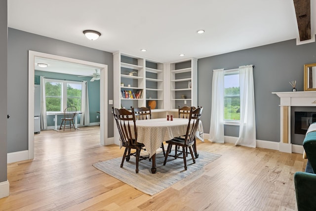 1228 Long Plains Rd, Buxton, ME 04093 - dining area with wood finished floors, a glass covered fireplace, recessed lighting, and ceiling fan