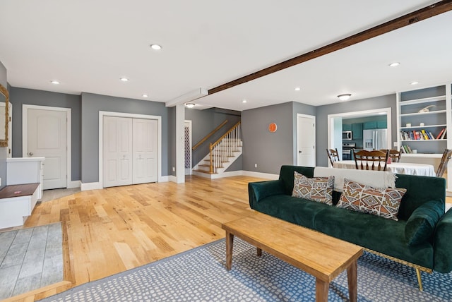 1228 Long Plains Rd, Buxton, ME 04093 - living room featuring stairs, light wood-style flooring, recessed lighting, and beam ceiling