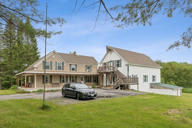 1228 Long Plains Rd, Buxton, ME 04093 - back of property with driveway, covered porch, a lawn, a chimney, and stairway