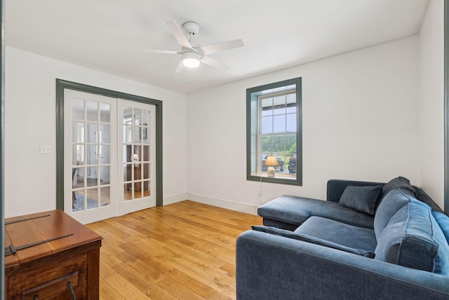 1228 Long Plains Rd, Buxton, ME 04093 - living area featuring french doors, light wood-style floors, and a ceiling fan
