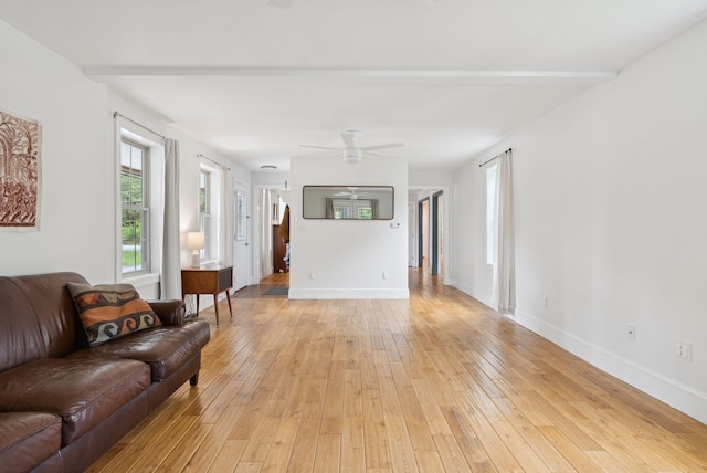1228 Long Plains Rd, Buxton, ME 04093 - living room with light wood-style floors and a ceiling fan