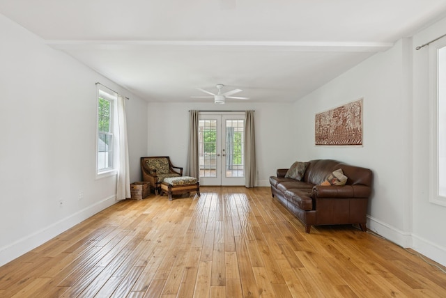1228 Long Plains Rd, Buxton, ME 04093 - living area with light wood-style floors, french doors, and a ceiling fan