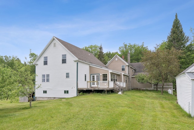 1228 Long Plains Rd, Buxton, ME 04093 - back of property with a lawn, a deck, a chimney, and a shingled roof