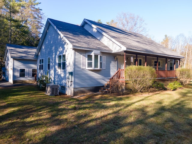 exterior space featuring a lawn, a shingled roof, covered porch, and cooling unit