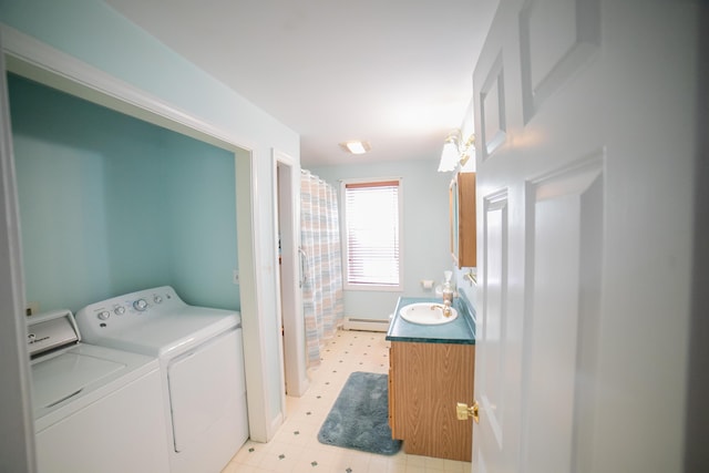 washroom featuring a sink, light floors, a baseboard radiator, and independent washer and dryer