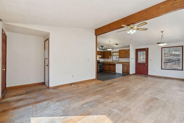 unfurnished living room featuring baseboards, a ceiling fan, and light wood-style flooring