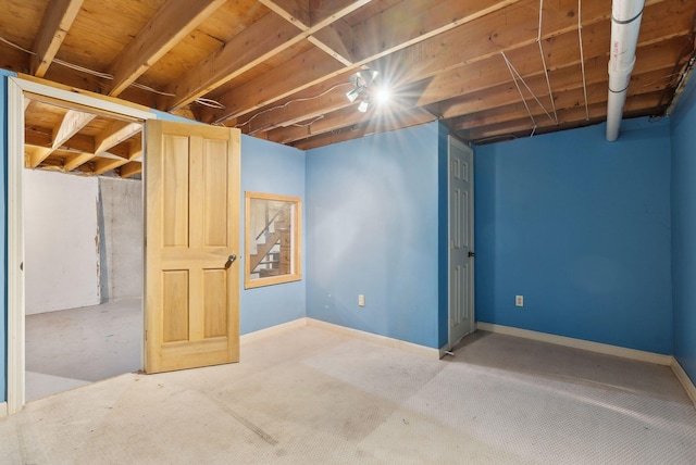 unfinished basement featuring baseboards