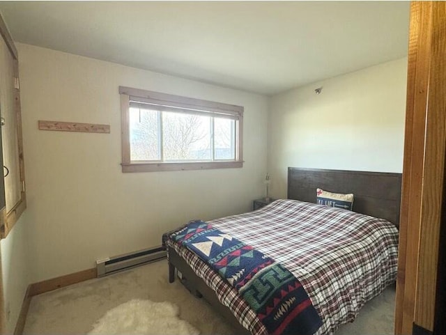 8 Fall Line Dr Unit S214, Newry, ME 04261 - bedroom with a baseboard heating unit, baseboards, and carpet