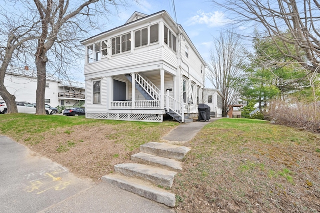 107 Northern Ave, Augusta, ME 04330 - american foursquare style home featuring stairs and a front yard