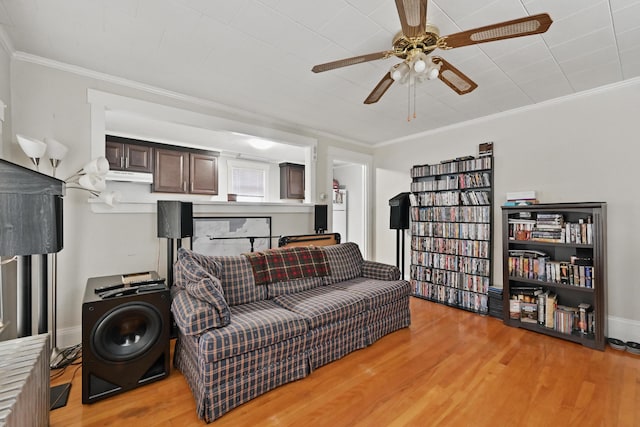 107 Northern Ave, Augusta, ME 04330 - living room featuring light wood-style floors, ornamental molding, baseboards, and ceiling fan