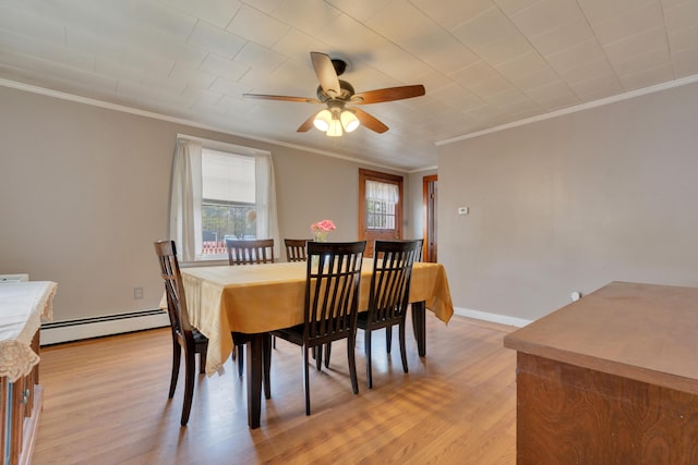 99 Ocean Park Rd, Saco, ME 04072 - dining room with ornamental molding, a baseboard radiator, a ceiling fan, and light wood-style floors