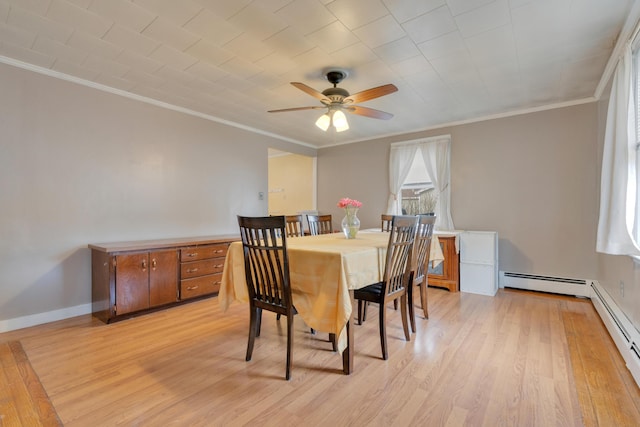 99 Ocean Park Rd, Saco, ME 04072 - dining area with a baseboard radiator, light wood finished floors, crown molding, and ceiling fan