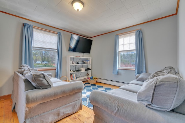 99 Ocean Park Rd, Saco, ME 04072 - living room with a baseboard radiator, ornamental molding, and hardwood / wood-style floors