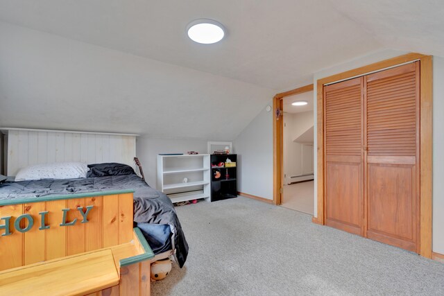 99 Ocean Park Rd, Saco, ME 04072 - carpeted bedroom featuring baseboard heating, baseboards, lofted ceiling, and a closet