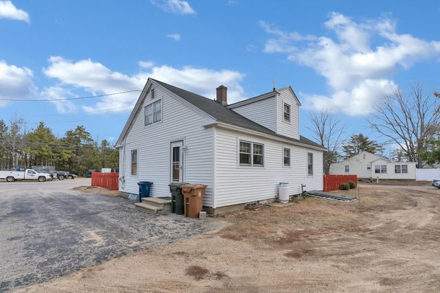 99 Ocean Park Rd, Saco, ME 04072 - view of side of home featuring a chimney