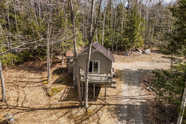 76 Cottage Shore Dr, Holden, ME 04429 - exterior space featuring dirt driveway and a wooded view