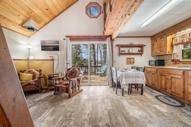 76 Cottage Shore Dr, Holden, ME 04429 - dining area featuring light wood-type flooring, vaulted ceiling, and wooden ceiling