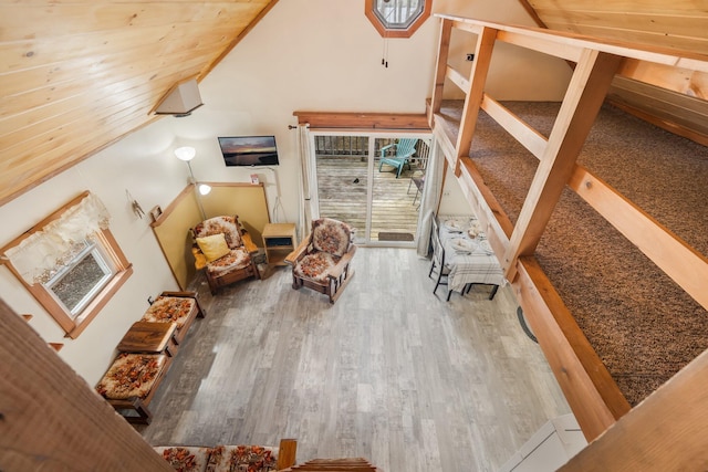 76 Cottage Shore Dr, Holden, ME 04429 - bedroom featuring wood finished floors, vaulted ceiling, and access to exterior