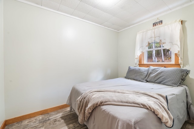 76 Cottage Shore Dr, Holden, ME 04429 - bedroom with baseboards, ornamental molding, and wood finished floors