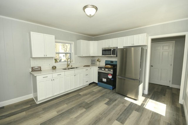 27 Church St, Livermore Falls, ME 04254 - kitchen featuring light countertops, white cabinets, stainless steel appliances, and a sink