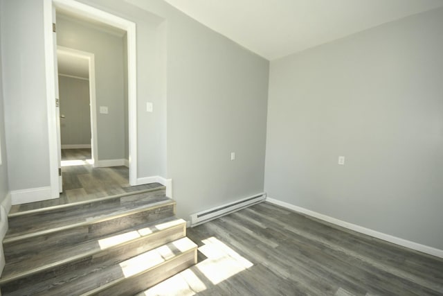 27 Church St, Livermore Falls, ME 04254 - empty room featuring a baseboard radiator, wood finished floors, and baseboards