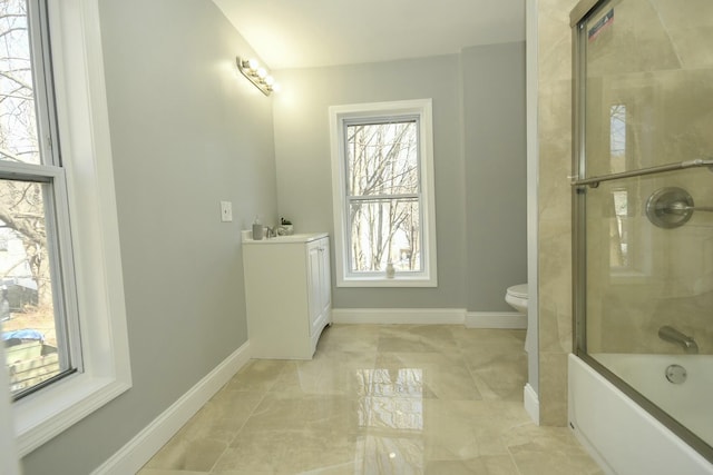 27 Church St, Livermore Falls, ME 04254 - full bath with baseboards, vanity, enclosed tub / shower combo, and toilet